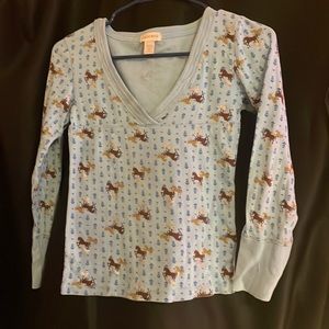 Like New: Girls long sleeve shirt w/ horse themed pattern on baby blue backdrop